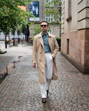 Beige Trench Coat with White Trousers and Teal Shirt