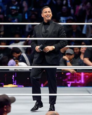 Black Brocade Tuxedo with Satin Lapels and Patent Leather Shoes