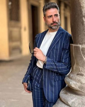 Navy Pinstriped Suit with White T-Shirt and Sneakers