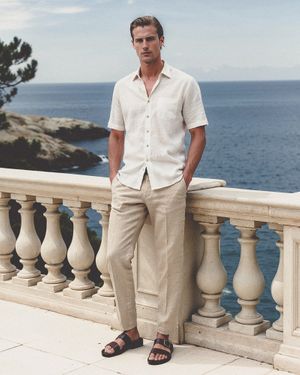 Short-Sleeve Linen Shirt with Beige Linen Trousers and Sandals